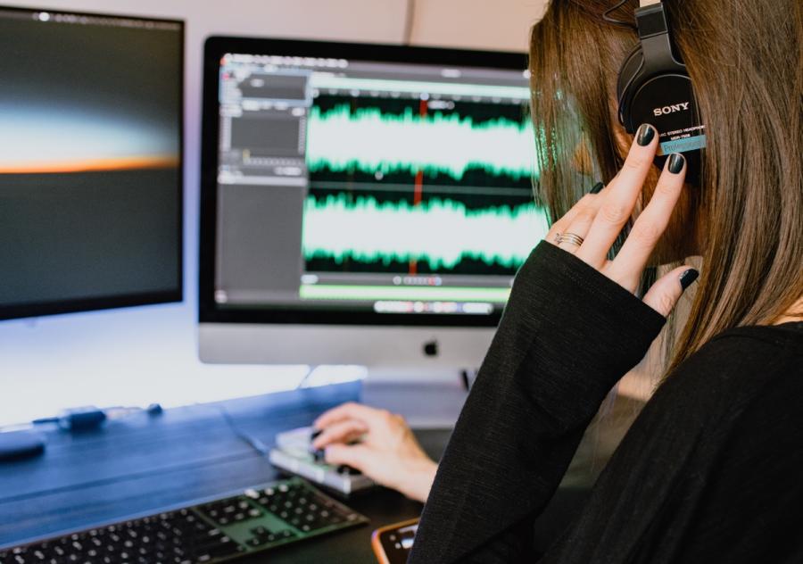 Woman Editing a podcast in Denver 